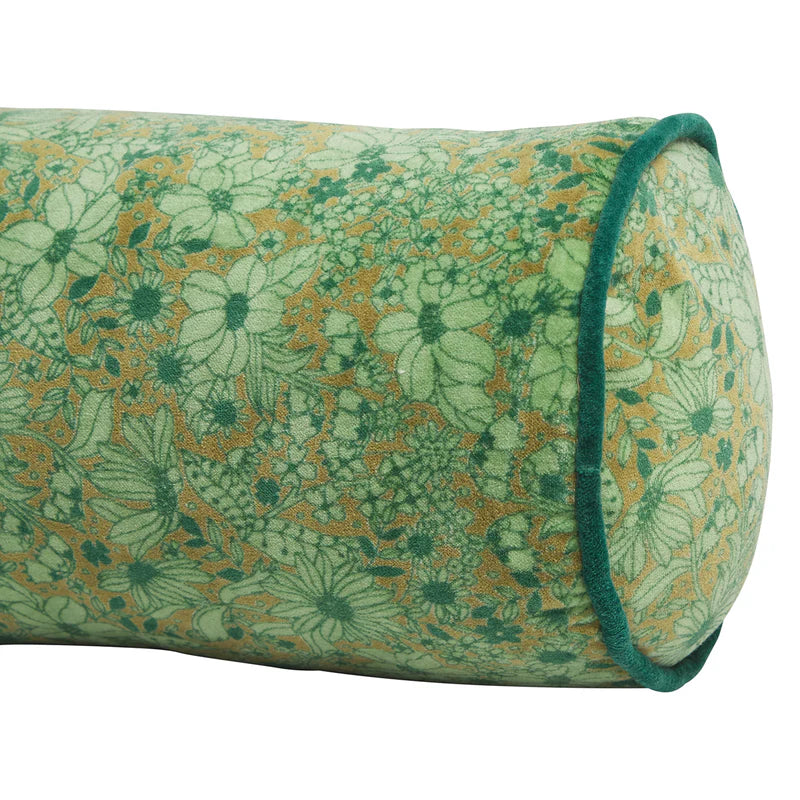 close up of floral green Evette Velvet Bolster by Sage & Clare with green pipping