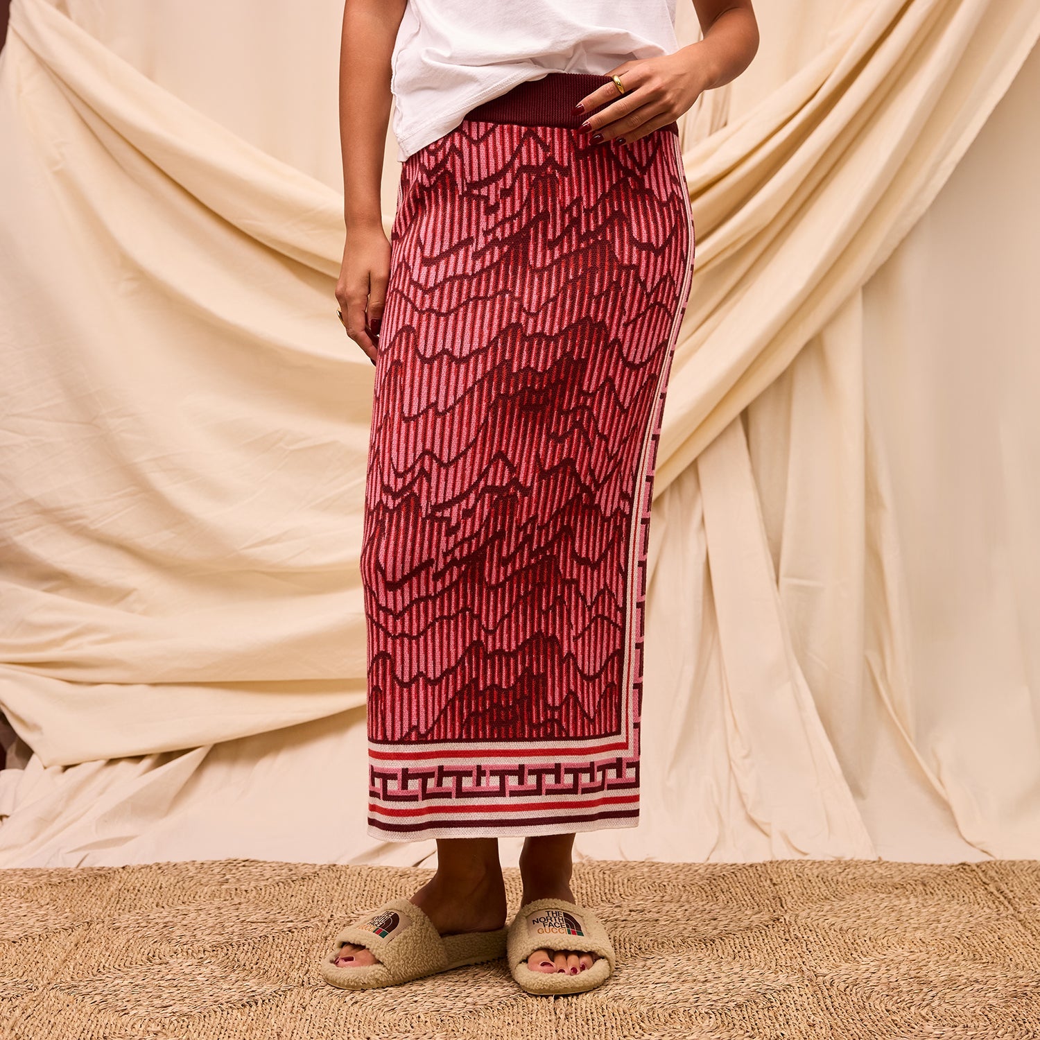Front view of Hanna Knit Maxi Skirt displaying detailed geometric pattern and decorative hemline border