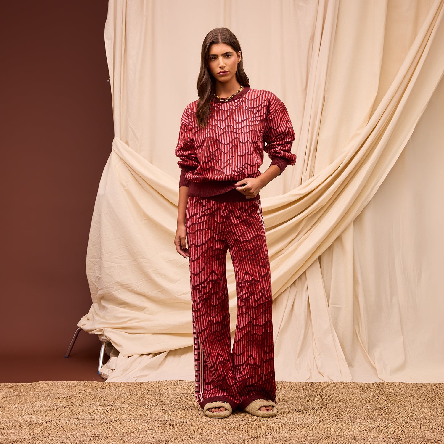 Full length view showing Hanna red knit sweater set with matching wide leg pants