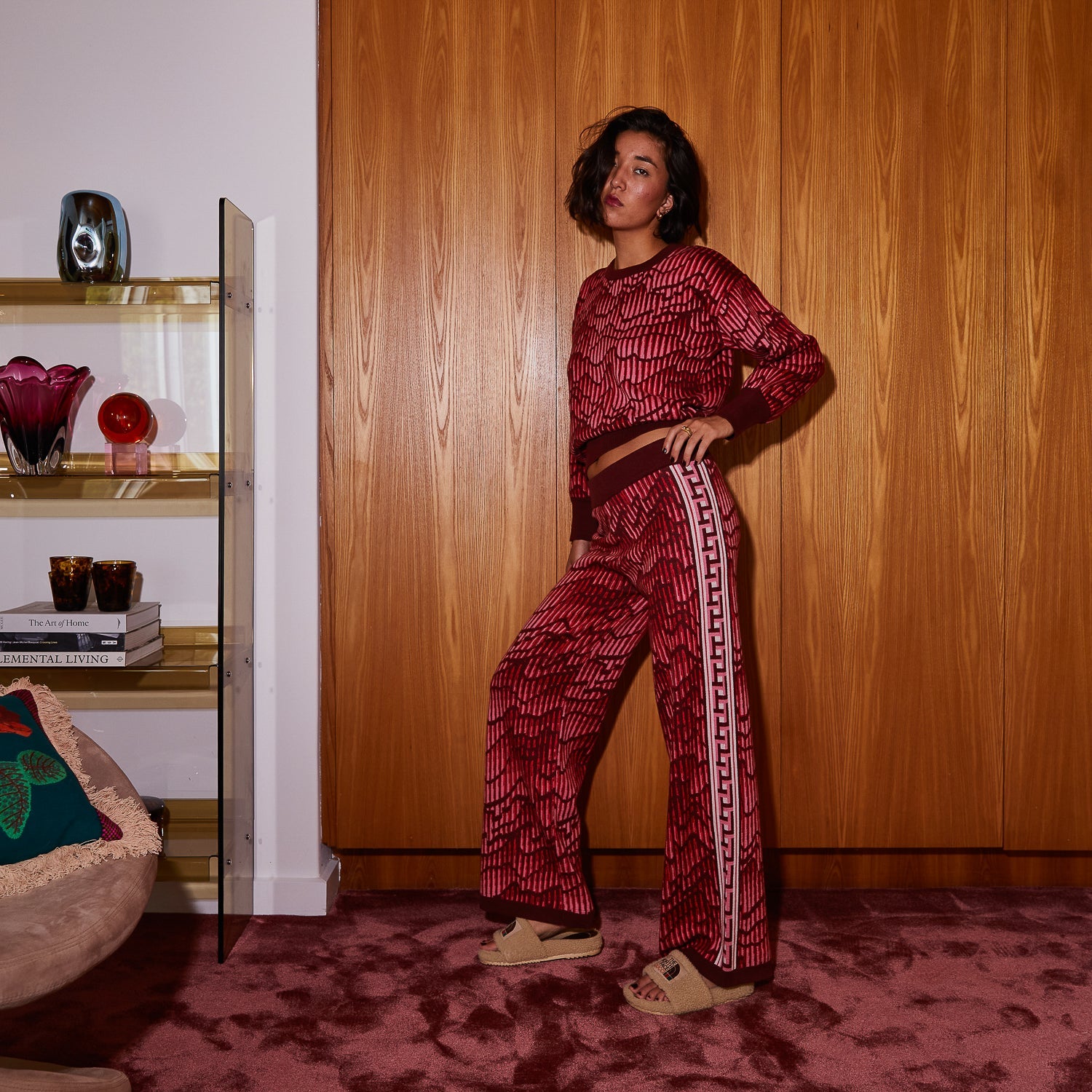 Side view of Hanna red knit sweater set showing relaxed fit and matching pants