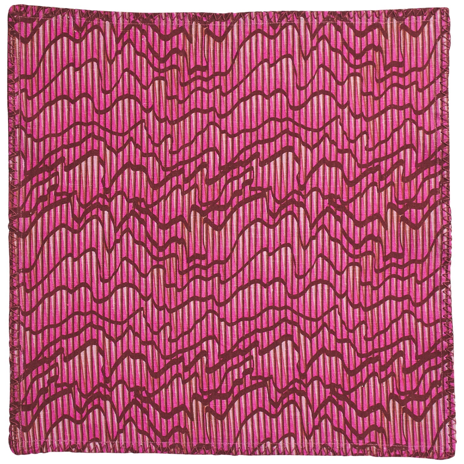 Single Hanna Pansy napkin flat lay showing complete colorful floral pansy pattern with zigzag stitched border