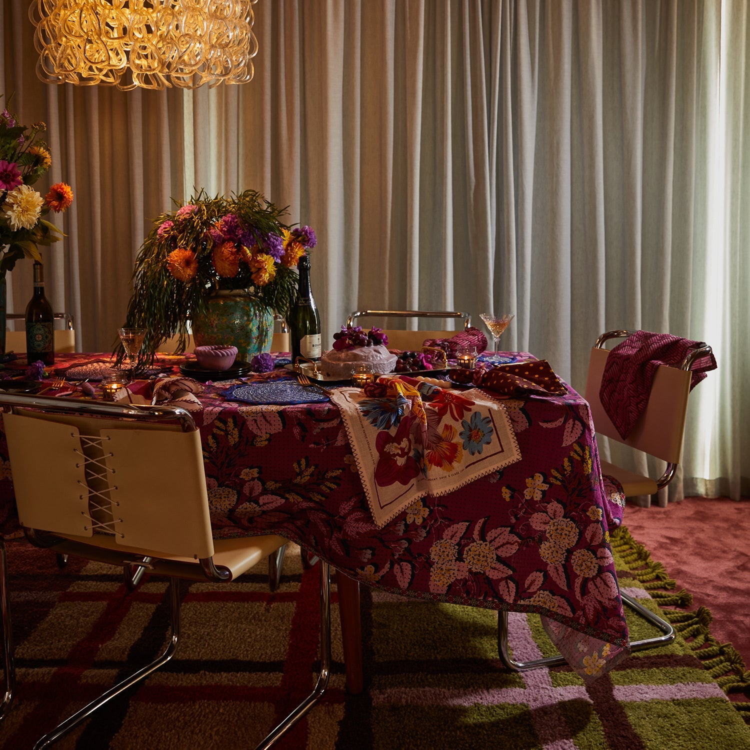 Detail view of Hanna Pansy napkin fabric texture showing pink zigzag stitching and colorful floral pattern