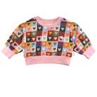 Front view of the Heart Checkerboard Oversized Jumper | Kapow Kids