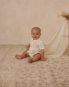 Henry Romper in Ivory by noralee - with piped chest detail and made from cotton poplin