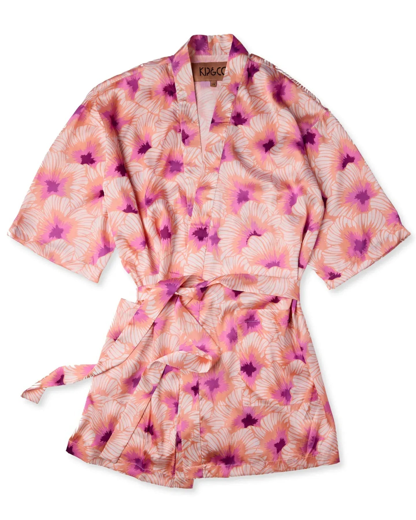 Woman wearing peach hibiscus print eco satin robe with tie waist in relaxed fit for comfortable lounging