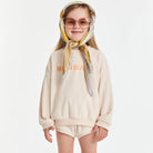 Holidays Sweater Shell by Golden Children worn by girl