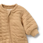 Close up front view of the Honey Fawn Organic Quilted Growsuit | Wilson + Frenchy