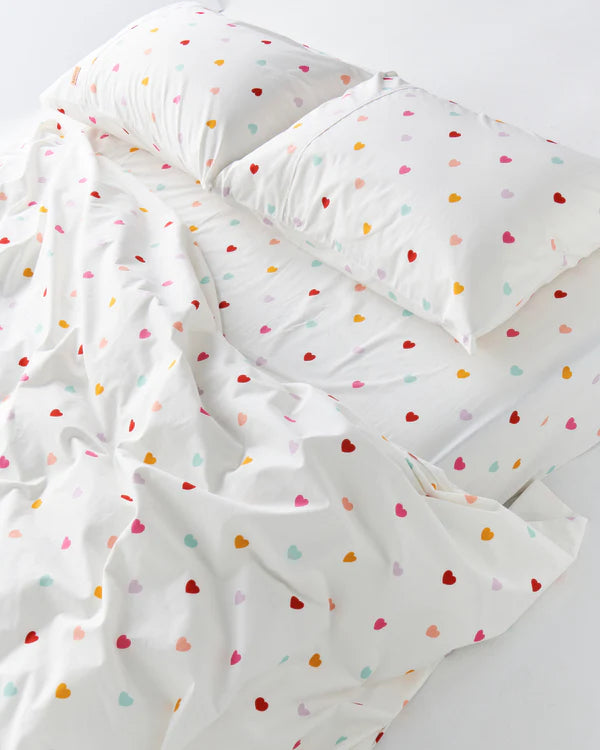 Organic cotton fitted sheet with multi coloured hearts - by Kip & CO