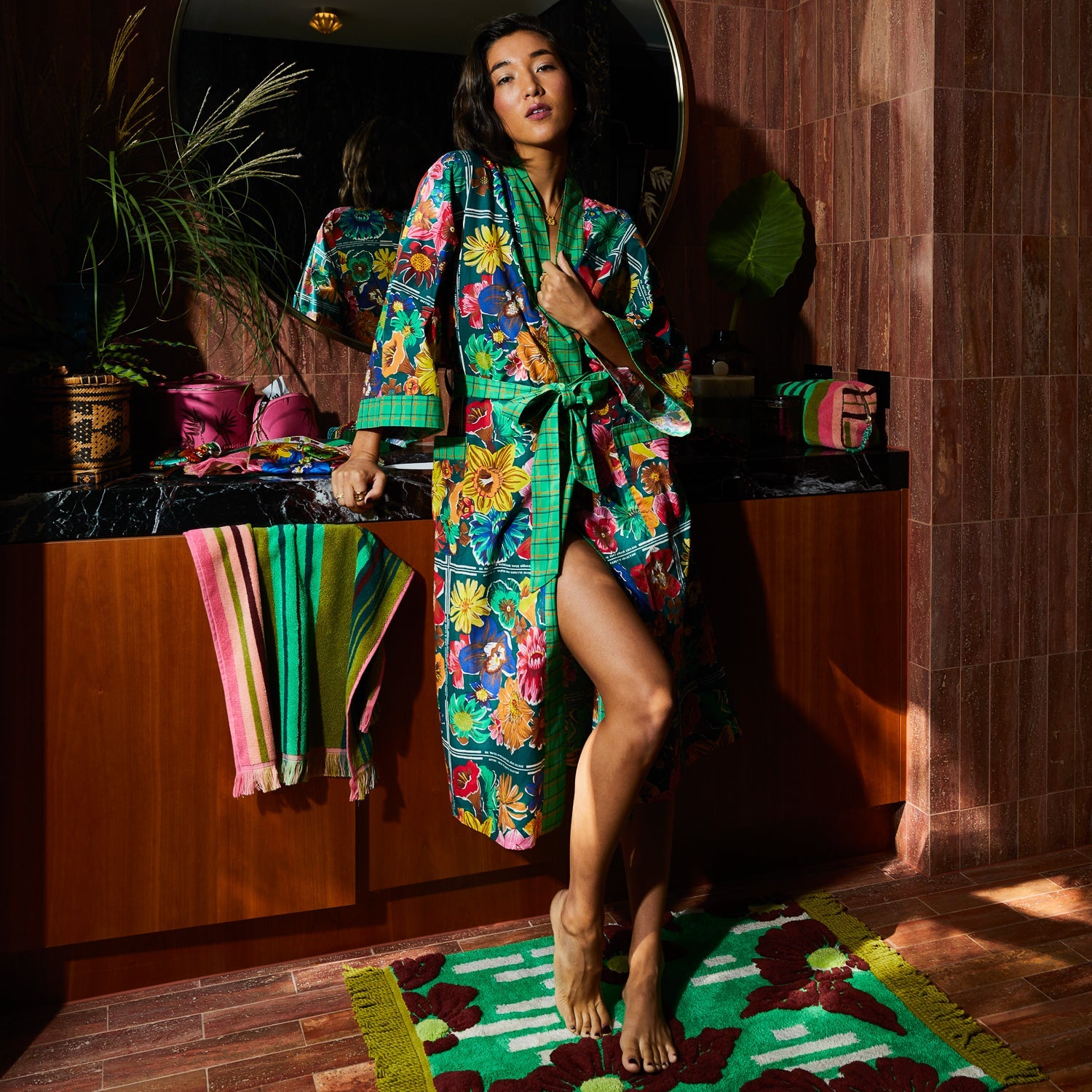 Model in Ines Cotton Robe with belt tied showing comfortable fit and vibrant tropical print pattern