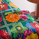 Close-up detail of vibrant floral print on Ines Silk Pillowcase Verdant showing silk texture and botanical motifs