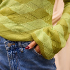 Close-up detail of Ingrid Knit Top showing raised geometric wave pattern and ribbed knit texture