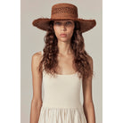 Model wearing Ivy Raffia Boater by Helen Kaminski