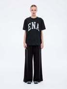 Front view of Jessie oversized collegiate tee in charcoal with white ENA lettering and relaxed fit