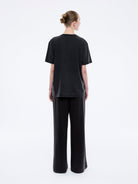 Back view of Jessie oversized tee in charcoal showing plain back design and loose silhouette