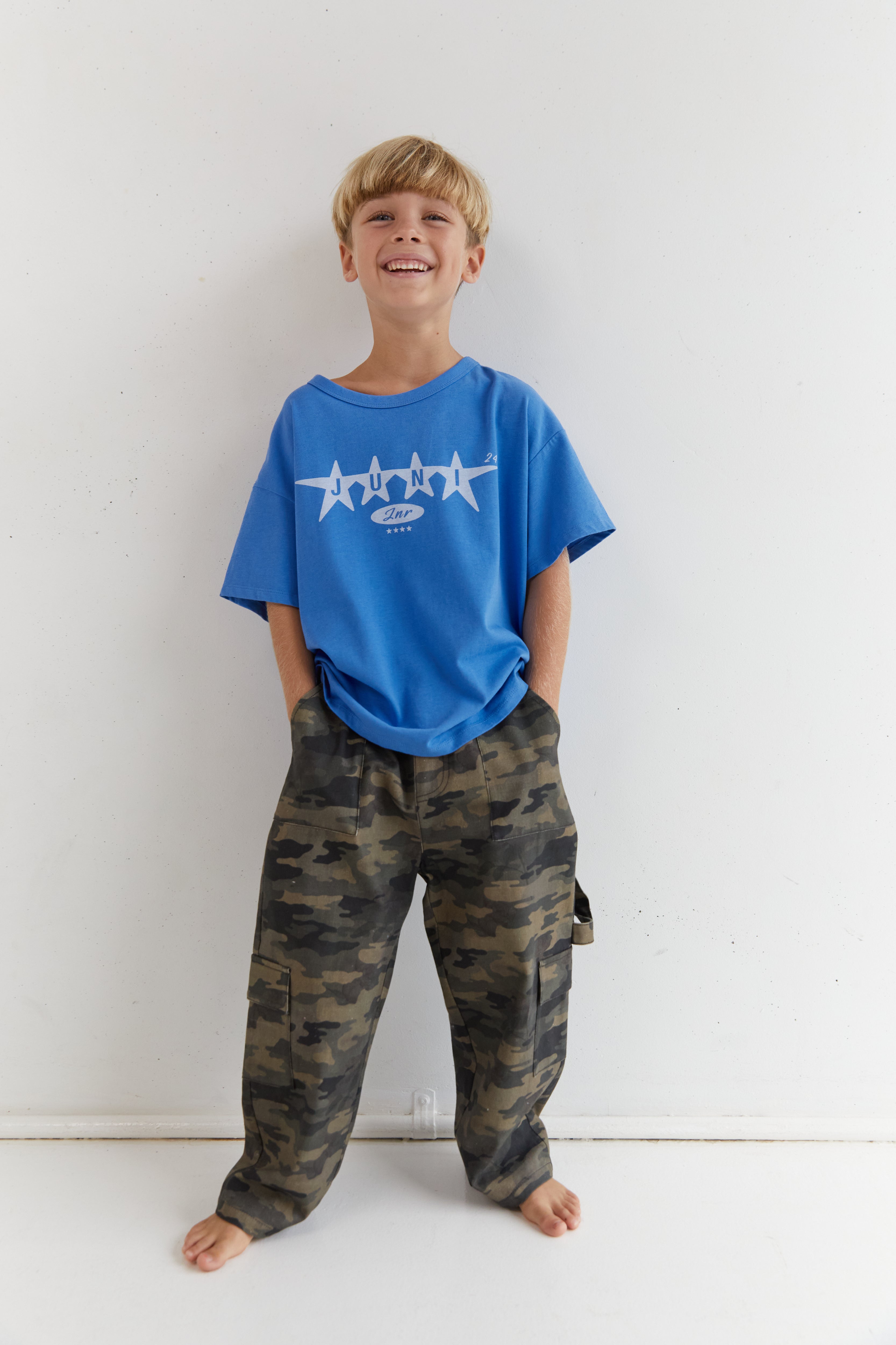 Front view of azure blue Star Tee with white star design and crew neck