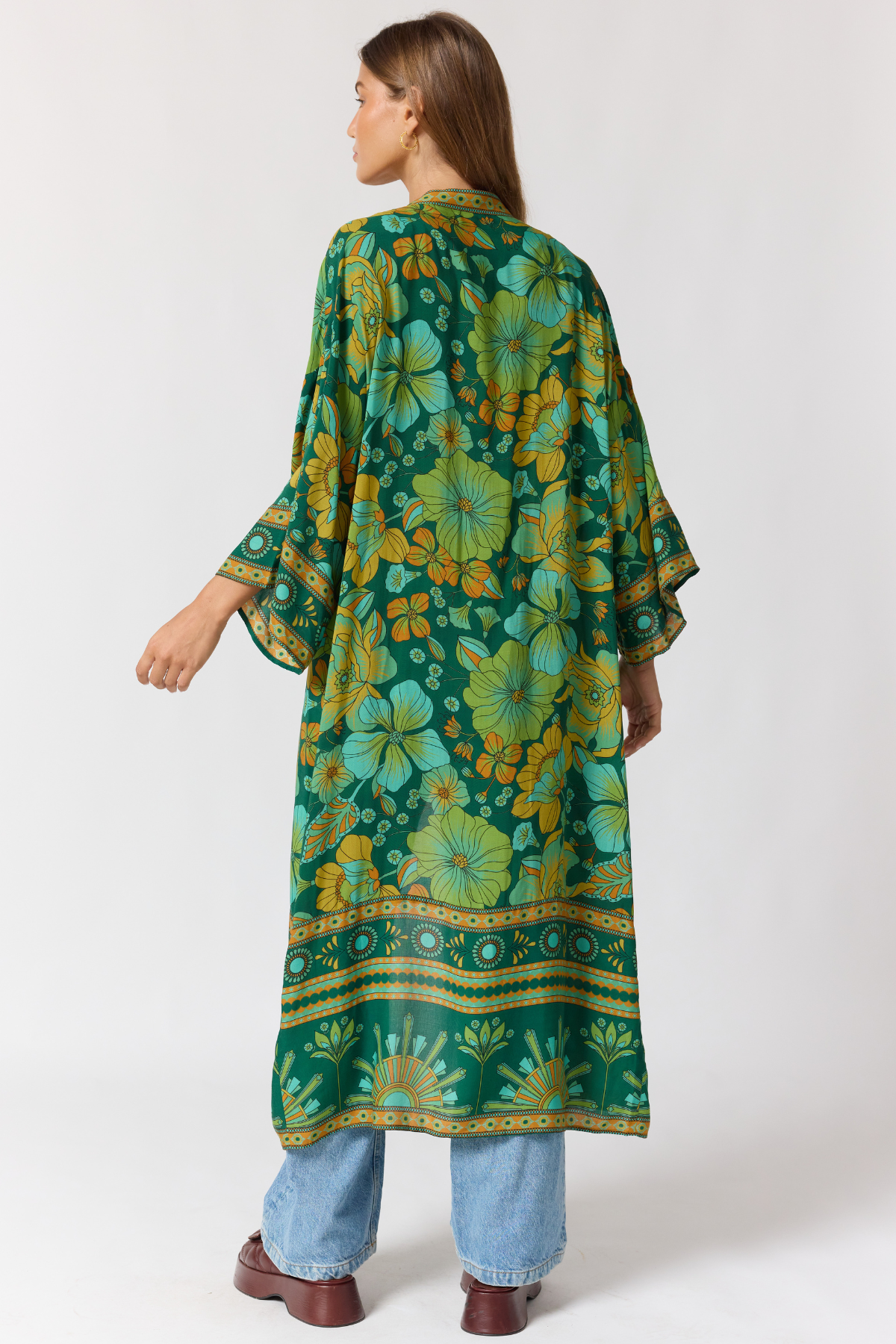 Jade robe fabric texture detail showing lightweight drape and emerald pattern