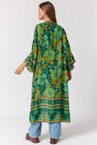 Jade robe fabric texture detail showing lightweight drape and emerald pattern