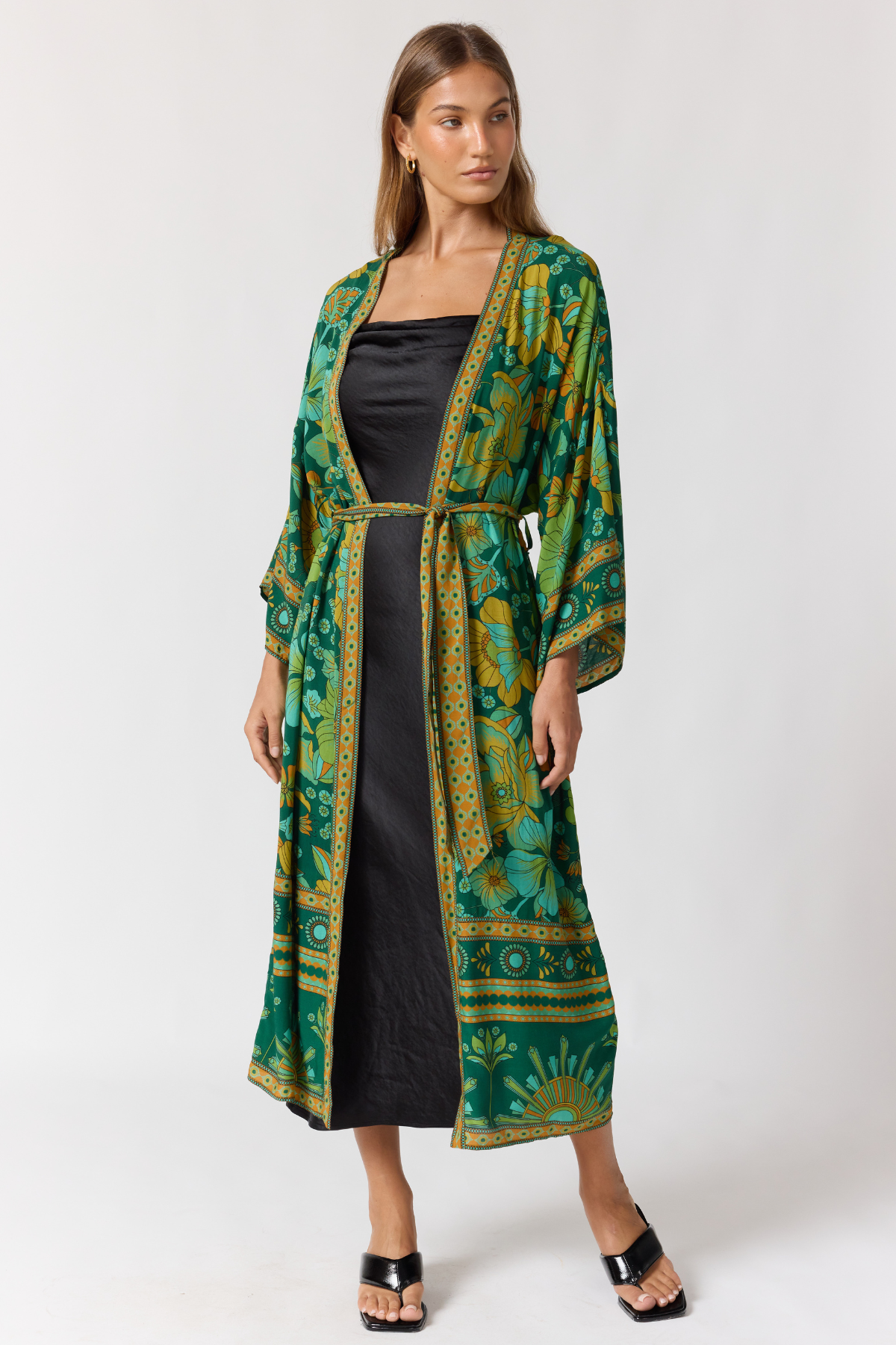 Nine Lives Bazaar emerald robe styled over dress