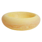 Side view of Jeanne Bowl in soft yellow marbled resin with warm honey tones and wide rounded rim