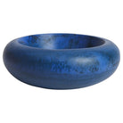 Side view of Jeanne Bowl in deep blue marbled resin with bold rounded donut form and wide rolled rim