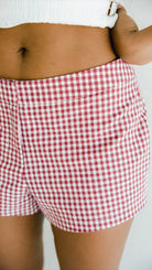 Model wearing June Tailored Short - Cherry Gingham by Juni