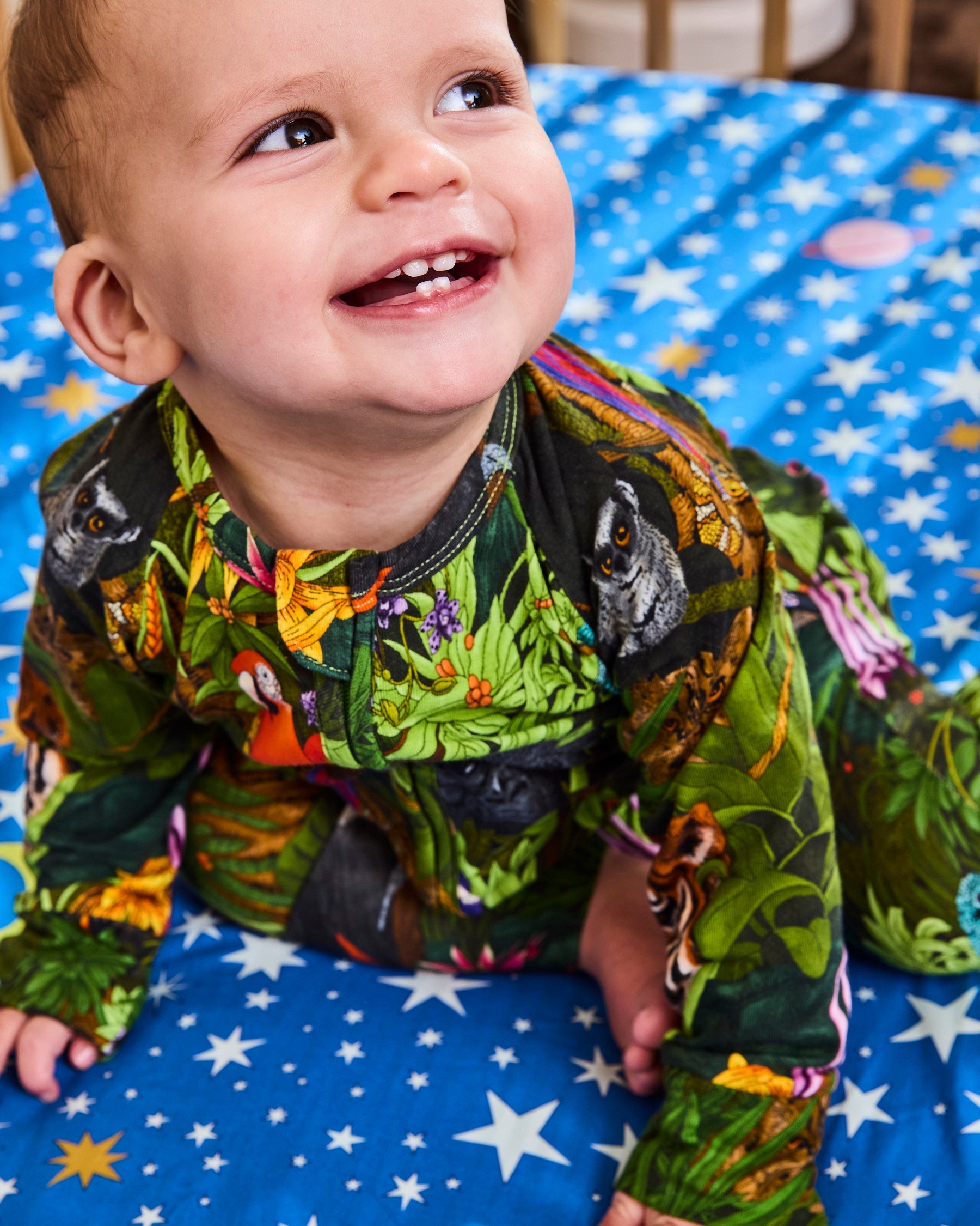 Baby in Kip & Co organic cotton zip romper for naptime