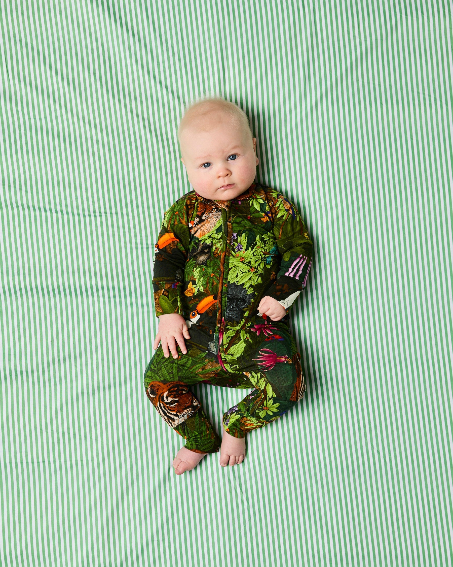 Jungle Life animal print pattern detail on organic cotton baby romper sleeves