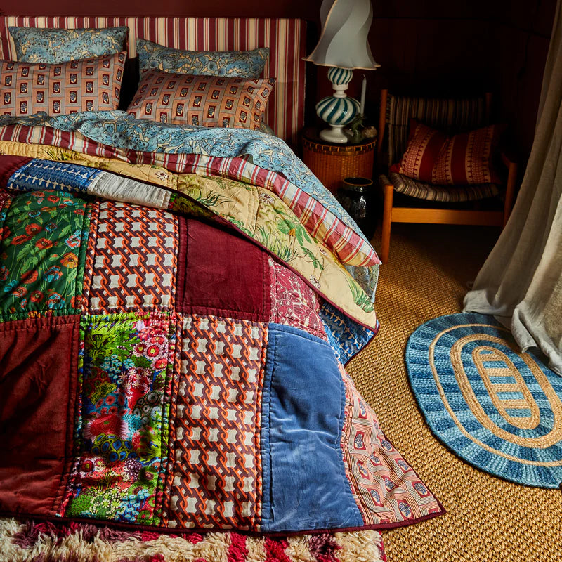 Kai Patchwork Bedcover – Garnet by Sage & Clare with red velvet panels
