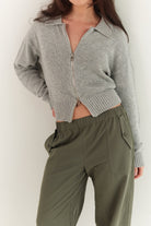Close-up front view of stone grey Kaia Zip Cardigan showing knit texture and zip detail