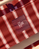 Close-up of velcro adjustable pillow system and side storage pocket on luxury beach chair