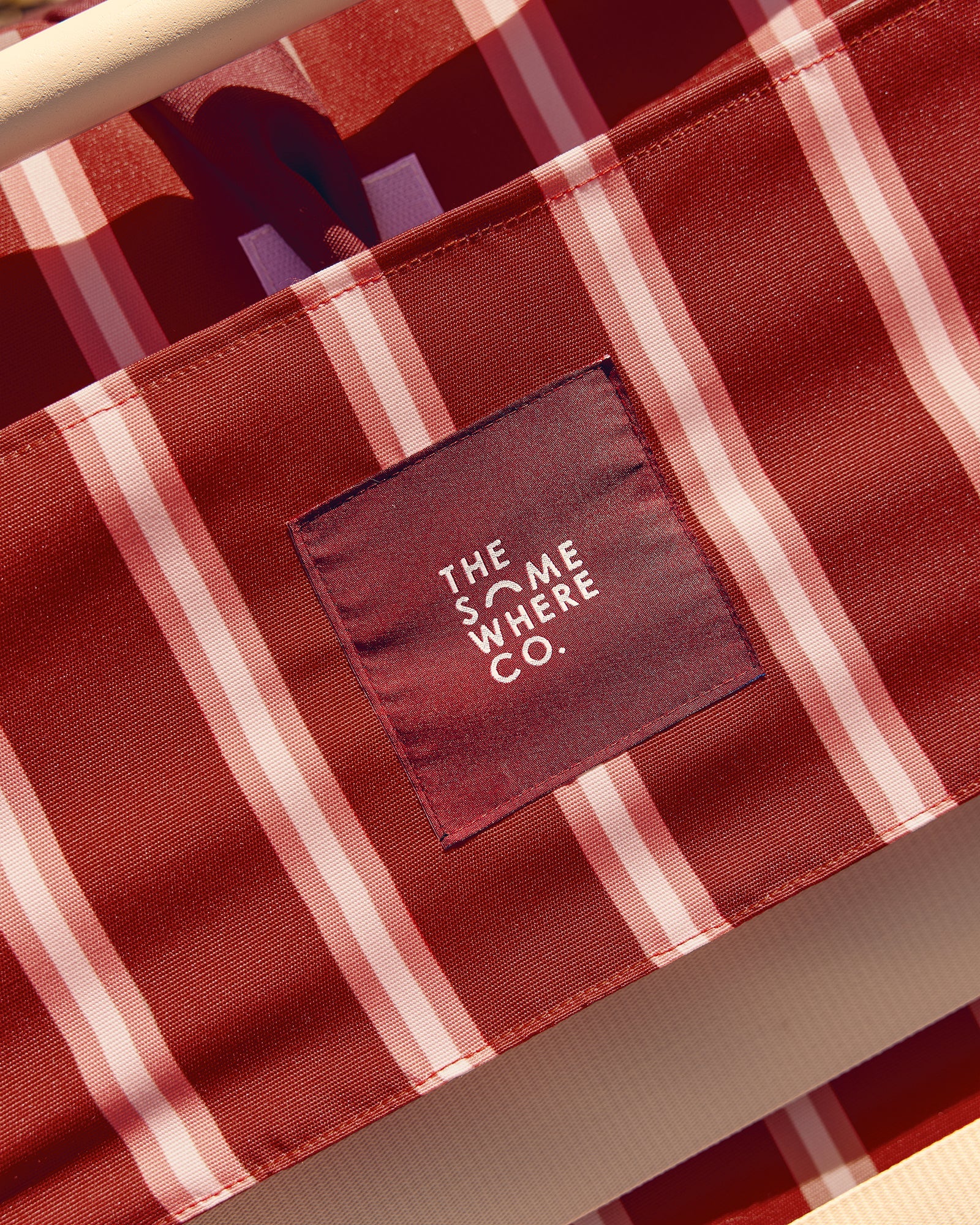 Close-up of velcro adjustable pillow system and side storage pocket on luxury beach chair