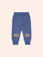 Front view of Huxbaby Kel Koala Trackpant in blue with koala appliques on knees and drawstring waist
