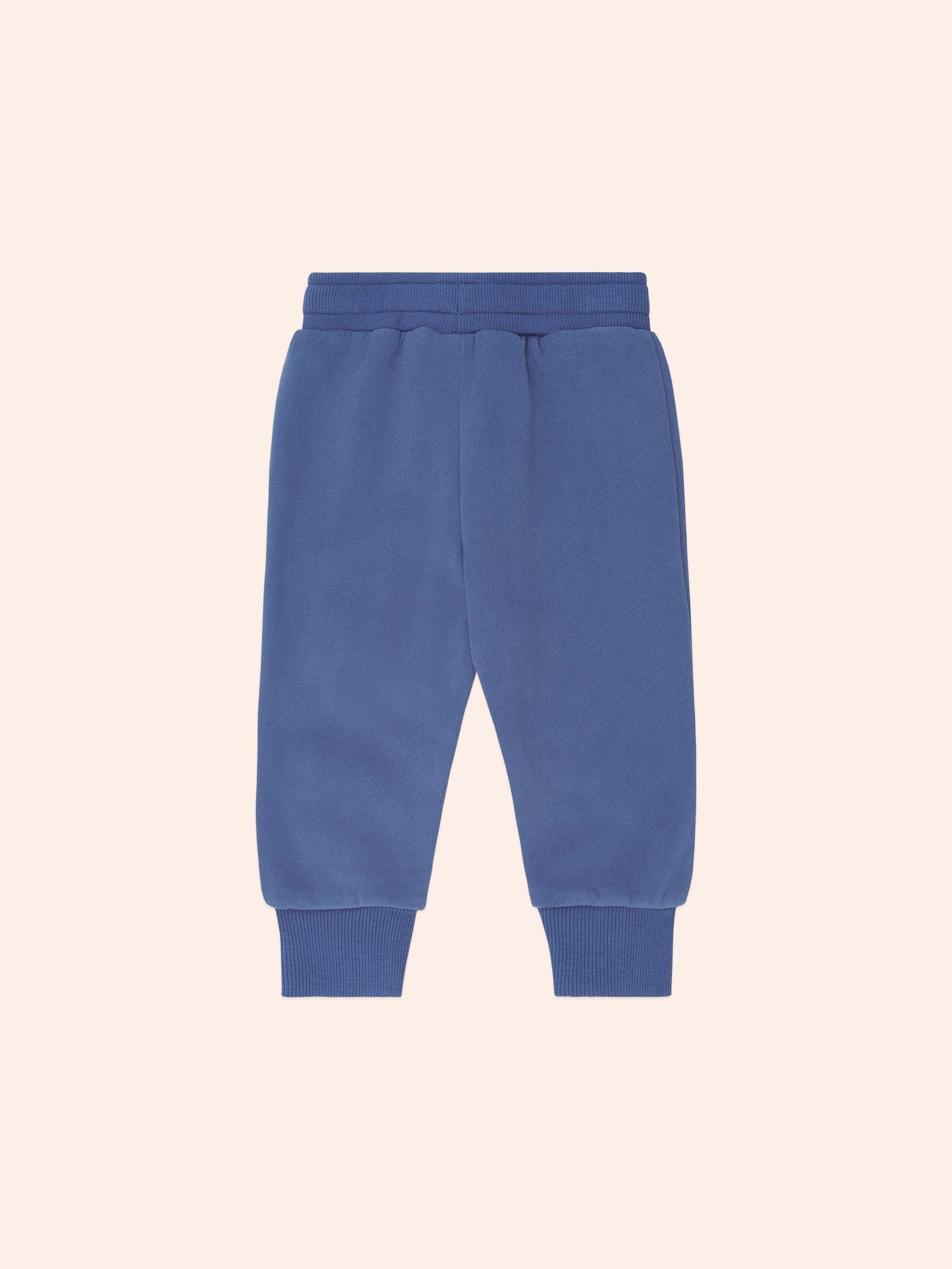 Back view of blue Huxbaby Kel Koala Trackpant showing ribbed cuffs and elastic waistband
