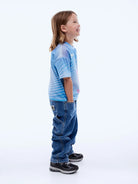 side view of child wearing Kids Solar Tee by Ena Pelly
