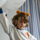 kid wearing Kidyears lion headphones by Kidywolf