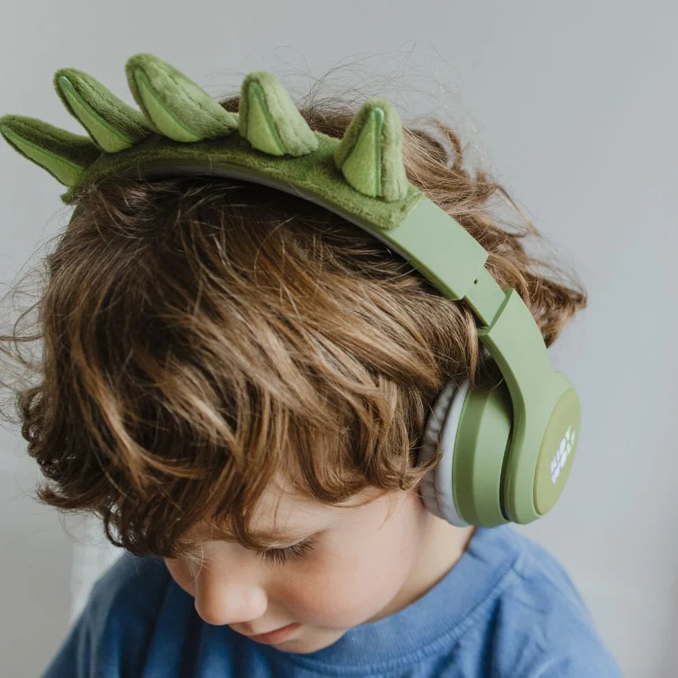Child wearing Kidyears dinosaur headphones by Kidywolf