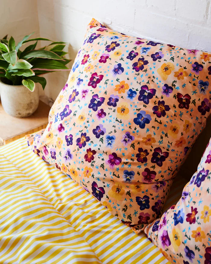 Pink, yellow and purple flowers on peach base. European pillowcase from Kip & Co