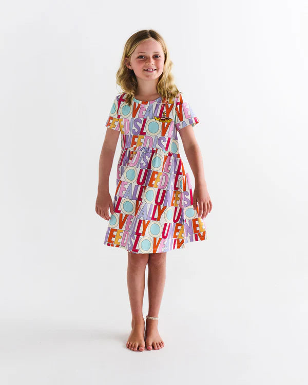 Girl wearing Kip & Co Beetles dress - All you need is love