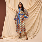 Model tying Koa Robe belt showcasing versatile styling options and fit