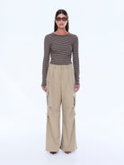 Full front view of Lainey Cargo Pant in sand with wide leg cut and distinctive cargo pocket design