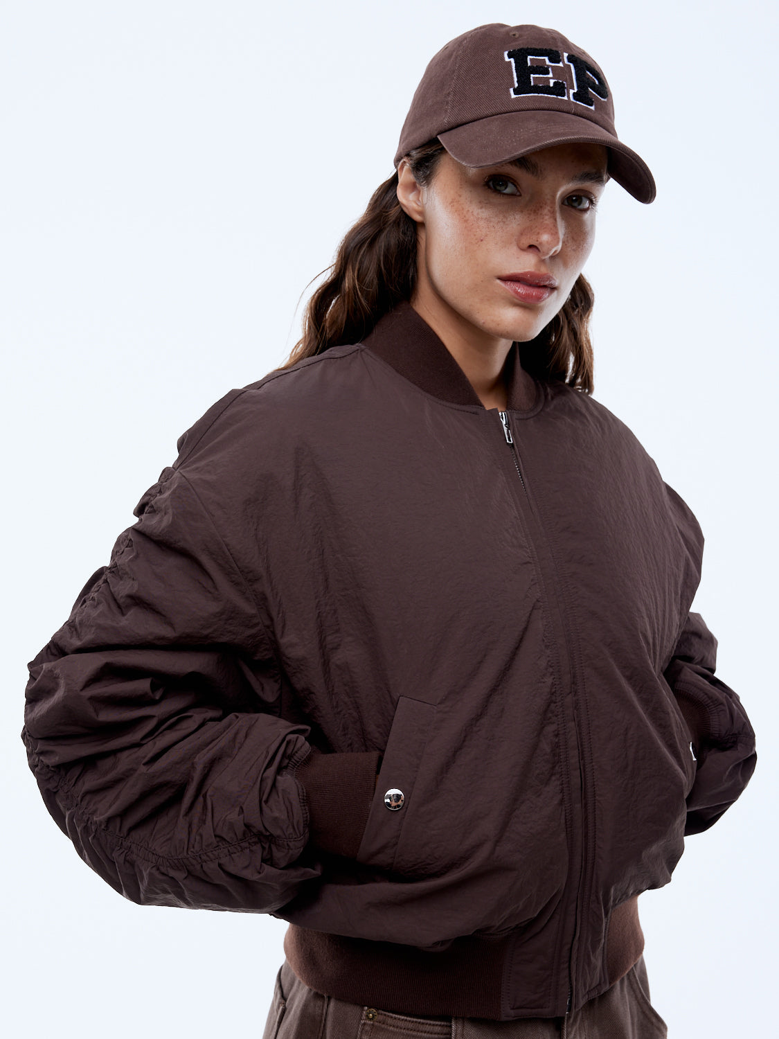 Ena Pelly Lulu Bomber worn by model showcasing relaxed drop shoulder silhouette street style look