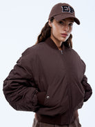 Ena Pelly Lulu Bomber worn by model showcasing relaxed drop shoulder silhouette street style look