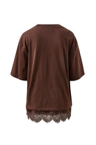 Back view of chocolate brown Lacey Tee displaying relaxed silhouette and lace hemline