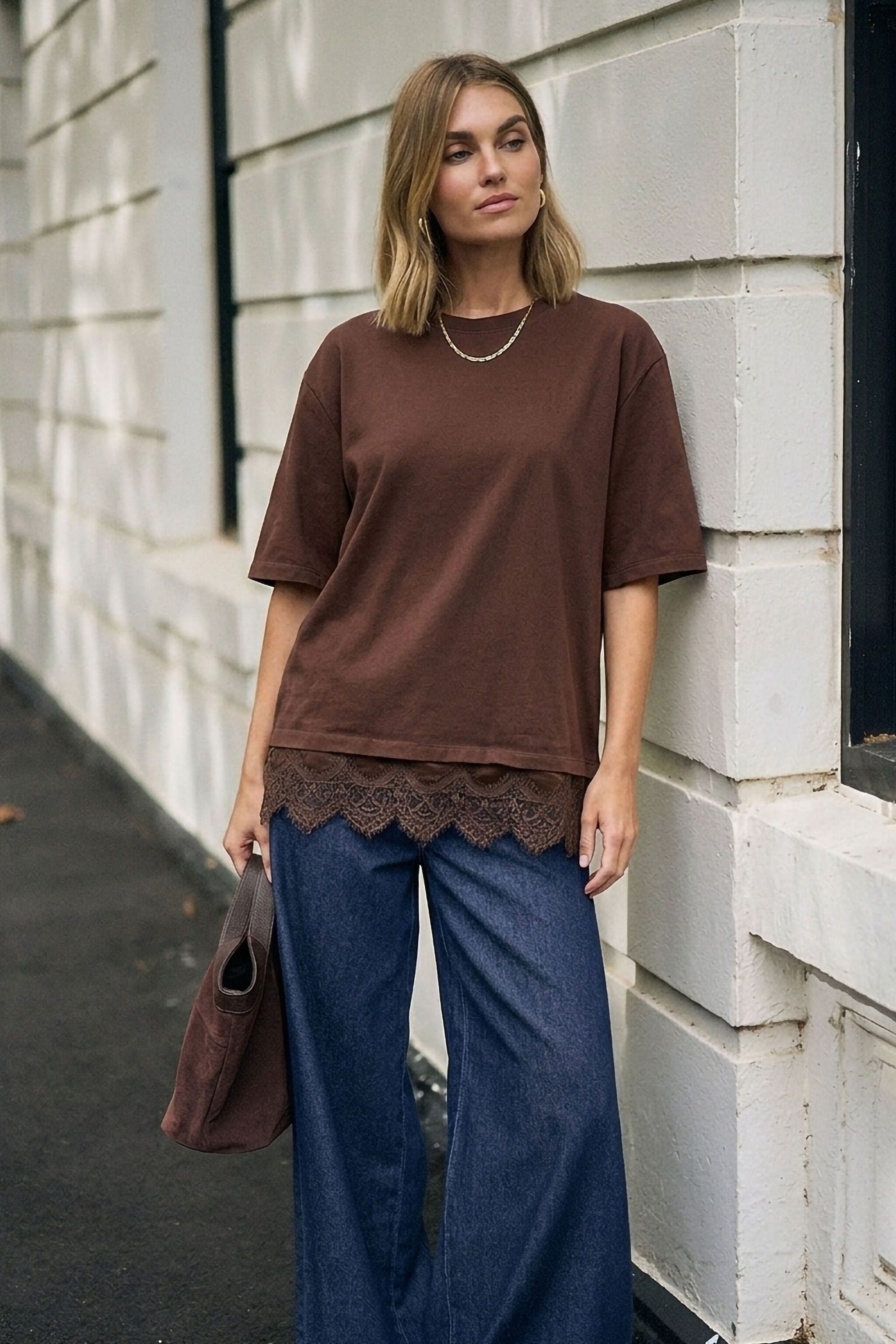 Full body shot of model in chocolate brown Lacey Tee showing relaxed fit and lace trim