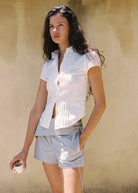 model wearing Lina Shirt - White by JUNI