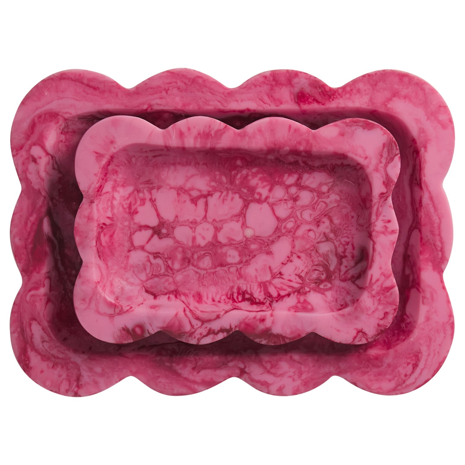 Crimson pink marbled resin scalloped trays nested in two sizes, overhead view on white background