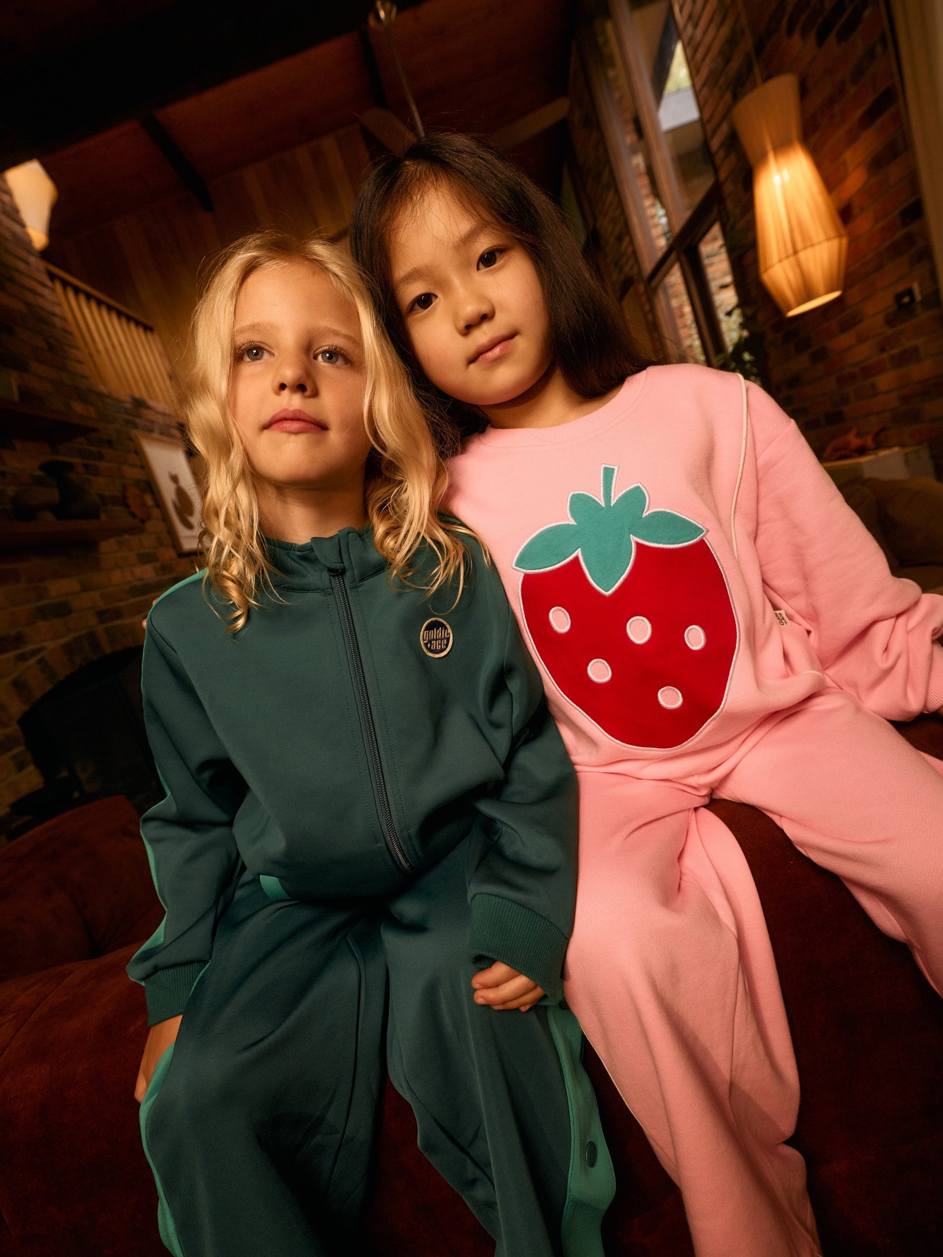 Girl wearing the green Logo Track Zip Jacket | Goldie + Ace