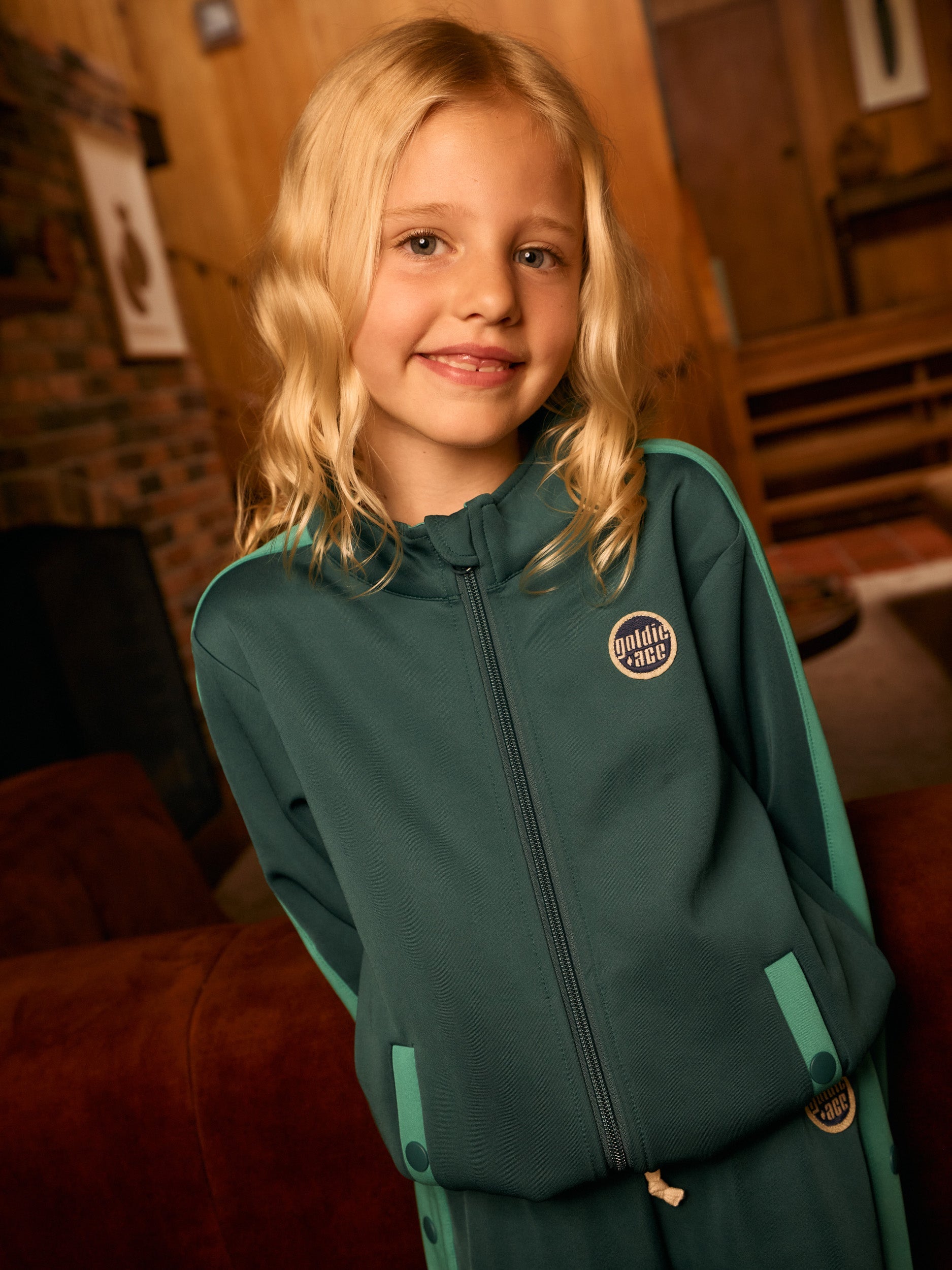 Young girl in the Logo Track Zip Jacket | Goldie + Ace