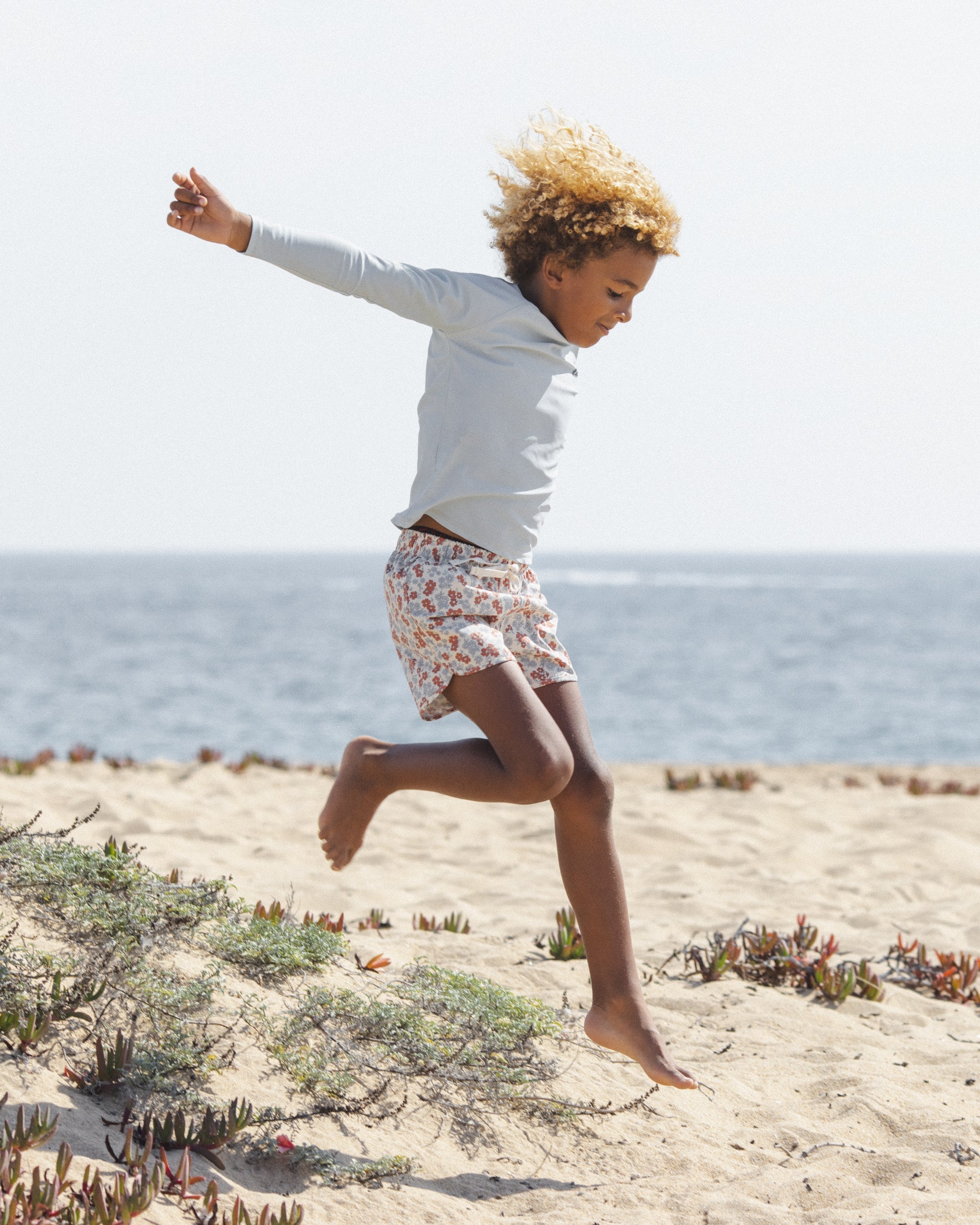 Boy wearing the Long Sleeve Rashguard Light Blue | Rylee + Cru