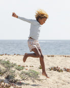 Boy wearing the Long Sleeve Rashguard Light Blue | Rylee + Cru